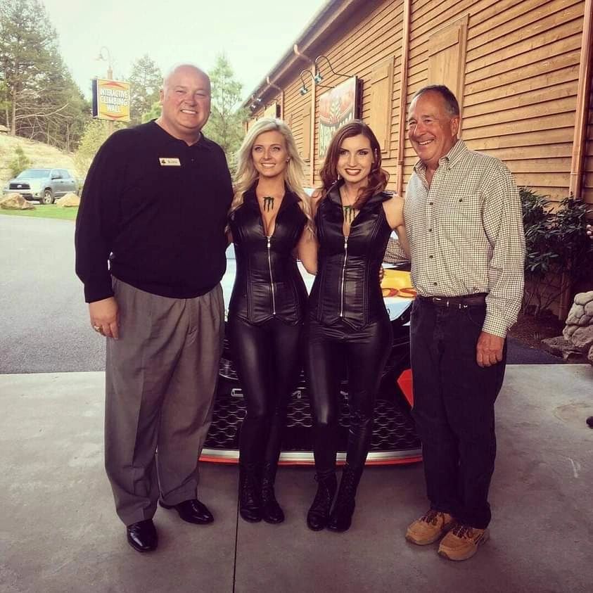 Four people at outdoor rustic venue event